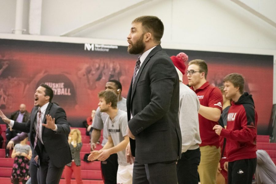 Associate Head Coach Dominick Moyer coaches the wrestling team Feb. 14 during NIUs 19-16 win over the University at Buffalo. The meet took place at Victor E. Court.