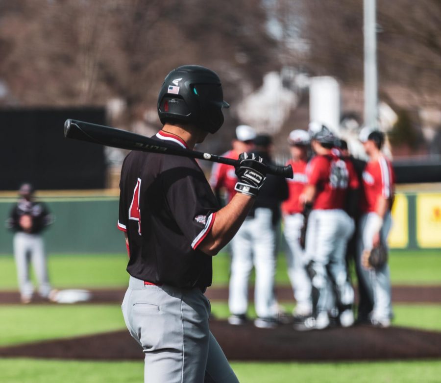 An NIU baseball player prepares to bat during a 2020 season game.