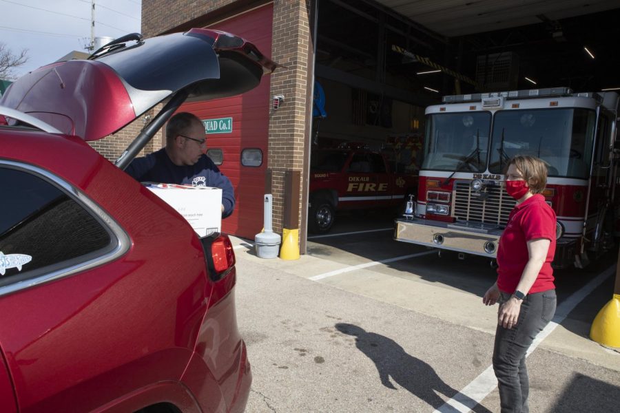 Sherrill Morris, NIU Chair of the School of Allied Health and Communications, delivers personal protective equipment to the DeKalb Fire Department.