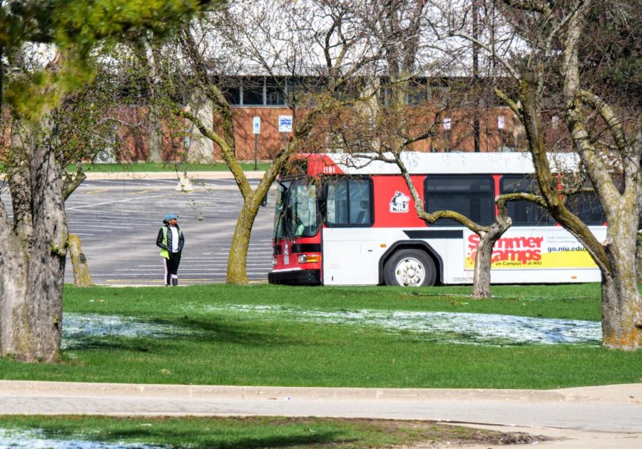 NIU Bus driver looks around an empty campus before continuing their route.