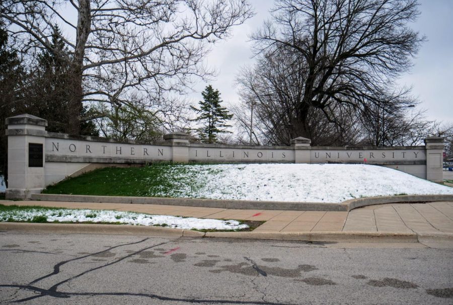 Snow in front of the NIUs main entrance begins to melt at the intersection of Castle Dr. and Lincoln Hwy on April 17.