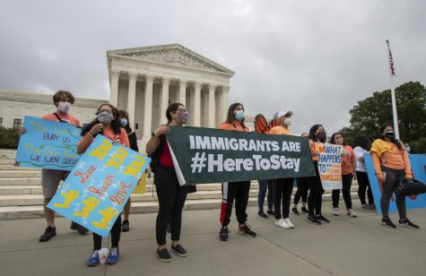 Deferred Action for Childhood Arrivals students stand Thursday in front of the Supreme Court after the Supreme Court ruled to block actions to end DACA.