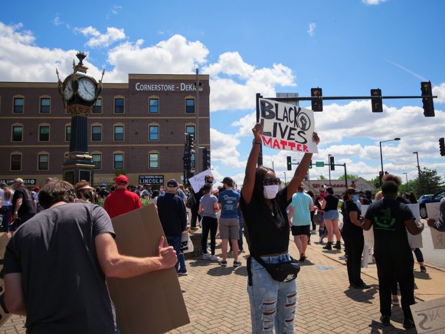 A protester holds up a sign during a Black Lives Matter protest.