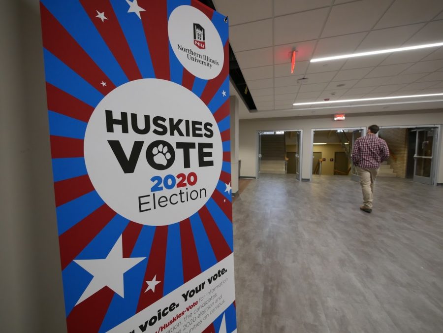 A+Huskies+Vote+sign+stands+in+the+Holmes+Student+Center.+