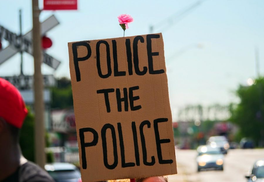 A Black Lives Matter protester holds up a sign in front of The DeKalb Police Department in support of police reform and Black Lives Matter on June 3rd.