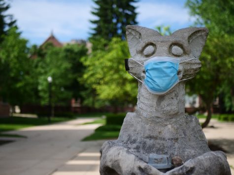 A mask is taped to NIUs Olive Goyle statue next to Altgeld Hall June 3.