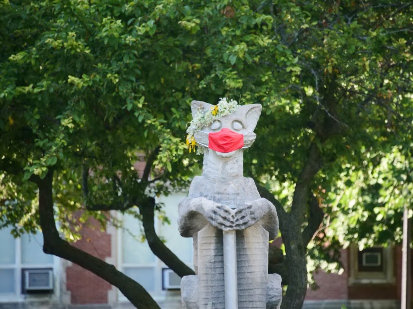 A mask is taped to NIUs Olive Goyle statue next to Altgeld Hall June 3, 2020.