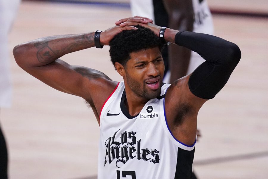 Los Angeles Clippers Paul George (13) reacts after being called for a foul during the first half of an NBA conference semifinal playoff basketball game against the Denver Nuggets, Wednesday, Sept. 9, 2020, in Lake Buena Vista, Fla.