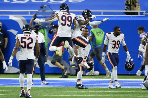 Chicago Bears Trevis Gipson (99) and Sherrick McManis (27) celebrate their 27-23 win against the Detroit Lions after an NFL football game in Detroit, Sunday, Sept. 13, 2020. 