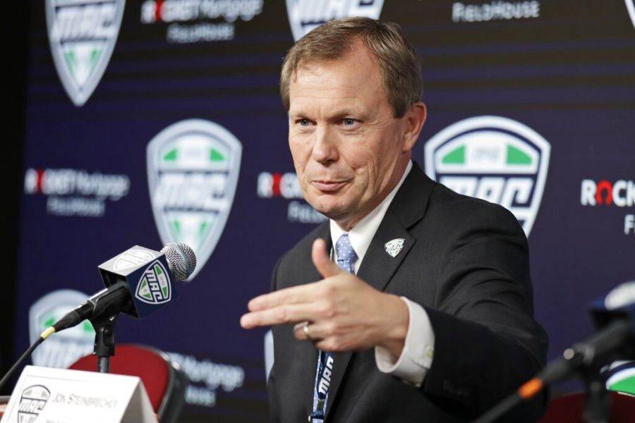 In this March 12, 2020, file photo, Mid-American Conference commissioner Jon Steinbrecher speaks during an NCAA college football news conference in Cleveland. The Mid-American Conference announced Friday, Sept. 25, 2020, that it will have a 6-game football season, meaning all 10 major conferences will play this fall.  (AP Photo/Tony Dejak, File)