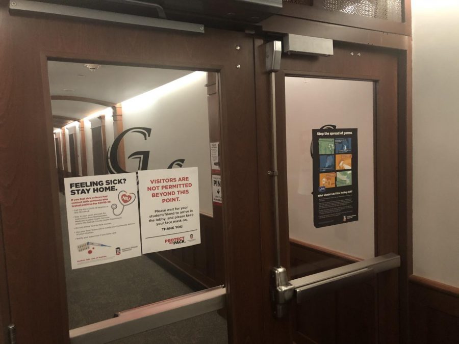 A door in Gilbert Residence Hall shows a sign stating No Visitors Allowed
