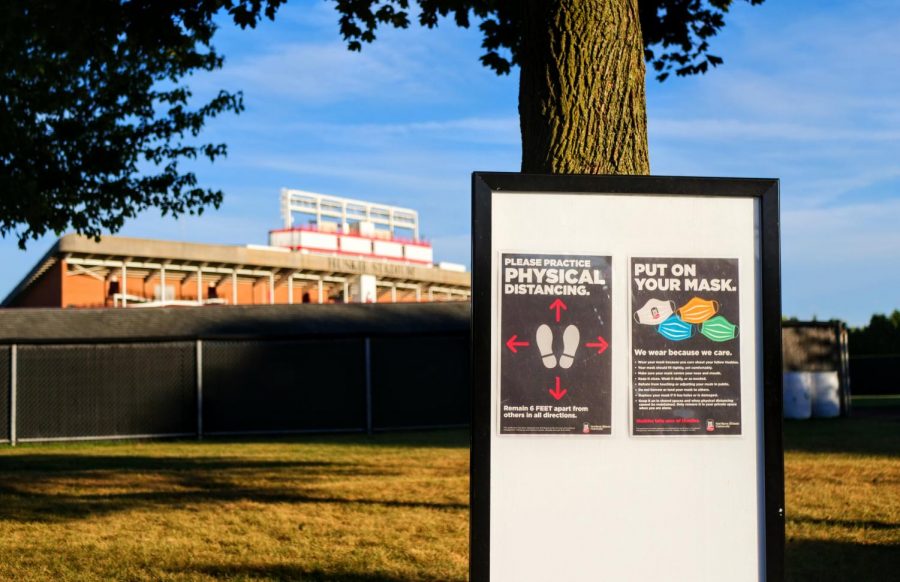 A COVID-19 awareness sign Sept. 2, posted in view of Huskie Stadium in DeKalb.