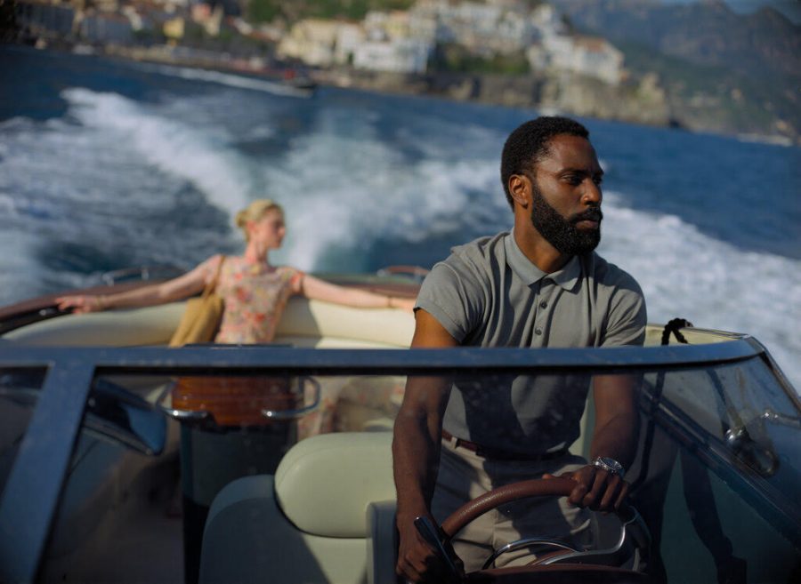 This image released by Warner Bros. Entertainment shows Elizabeth Debicki, left, and John David Washington in a scene from Tenet.  (Melinda Sue Gordon/Warner Bros. Entertainment via AP)