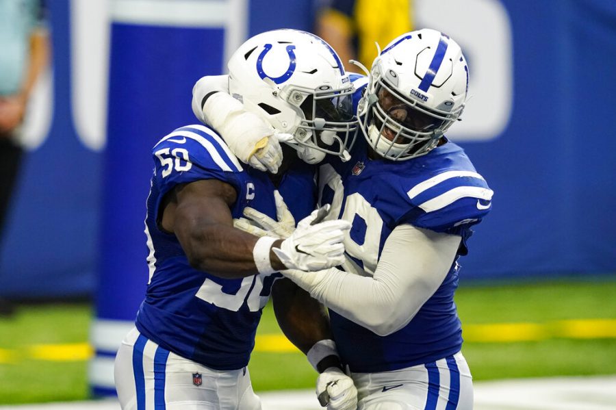 Indianapolis Colts defensive end Justin Houston (50) and defensive tackle DeForest Buckner (99) celebrates a safety against the New York Jets in the second half of an NFL football game in Indianapolis, Sunday, Sept. 27, 2020. 