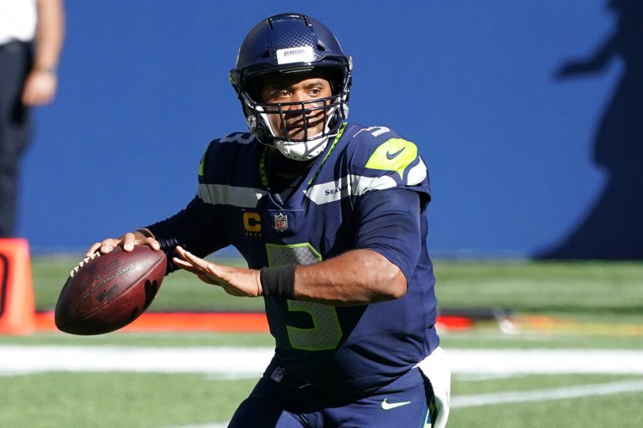 Seattle Seahawks quarterback Russell Wilson passes against the Dallas Cowboys during the first half of an NFL football game, Sunday, Sept. 27, 2020, in Seattle. 