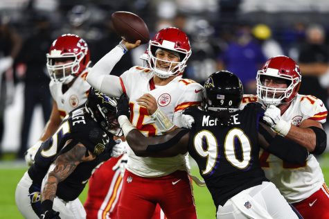 Kansas City Chiefs quarterback Patrick Mahomes (15) throws under pressure by Baltimore Ravens outside linebacker Pernell McPhee (90) during the first half of an NFL football game Monday, Sept. 28, 2020, in Baltimore.