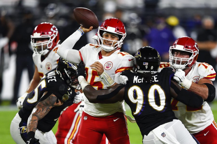 Kansas+City+Chiefs+quarterback+Patrick+Mahomes+%2815%29+throws+under+pressure+by+Baltimore+Ravens+outside+linebacker+Pernell+McPhee+%2890%29+during+the+first+half+of+an+NFL+football+game+Monday%2C+Sept.+28%2C+2020%2C+in+Baltimore.