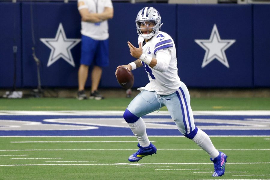 Dallas Cowboys quarterback Dak Prescott (4) scrambles out of the pocket before throwing a pass in the second half of an NFL football game against the Cleveland Browns in Arlington, Texas, Sunday, Oct. 4, 2020. (AP Photo/Ron Jenkins)