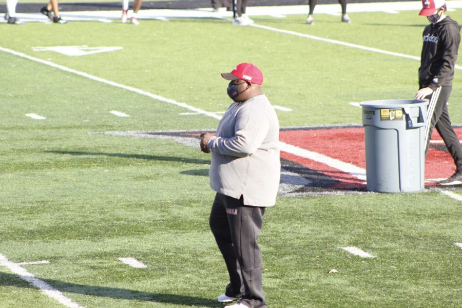 Head Coach Thomas Hammock observes NIUs practice Oct. 16, at Huskie Stadium.