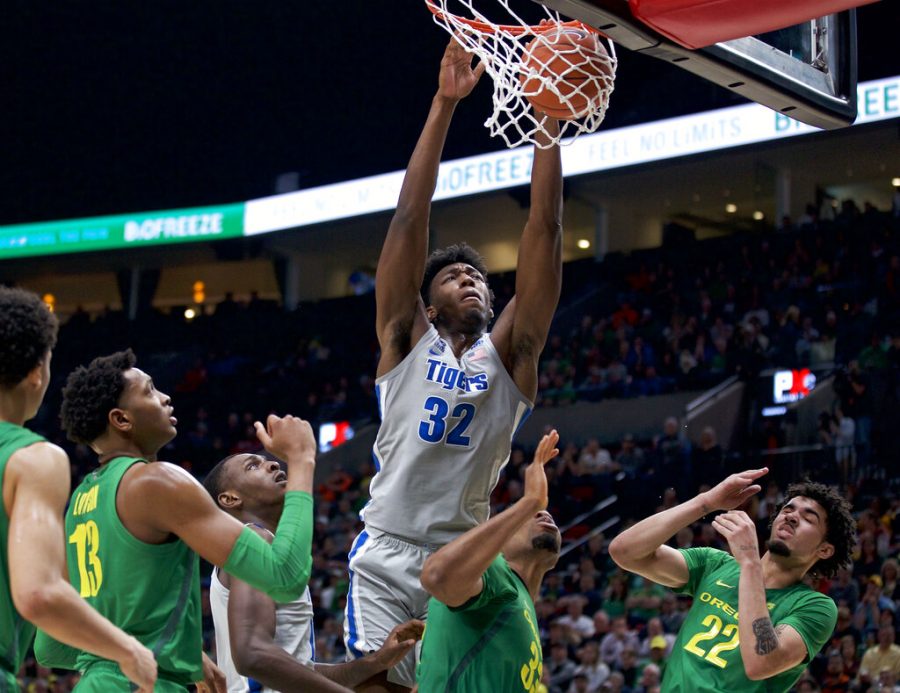 FILE - Memphis center James Wiseman (32) dunks against Oregon during the second half of an NCAA college basketball game in Portland, Ore., in this Tuesday, Nov. 12, 2019, file photo. At long last, James Wiseman is about to be on a team again. More than a year removed from the end of his three-game college career that was doomed almost before it started because of NCAA rulings regarding his eligibility, the 7-foot-1 left-hander will be one of the first players selected in Wednesday’s, Nov. 18, 2020, NBA draft. It’s hard to envision a scenario where he doesn’t go in the first three picks, which are currently held by Minnesota, Golden State and Charlotte.