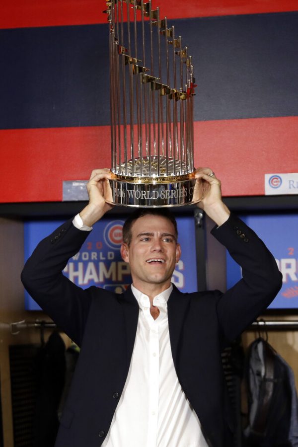 FILE - In this Nov. 3, 2016, file photo, Chicago Cubs president of baseball operations Theo Epstein celebrates after Game 7 of the Major League Baseball World Series in Cleveland. Theo Epstein, who transformed the long-suffering Chicago Cubs and helped bring home a drought-busting championship in 2016, is stepping down after nine seasons as the clubs president of baseball operations. The team announced Monday, Nov. 16, 2020, Epstein is leaving the organization, and general manager Jed Hoyer is being promoted to take his place.