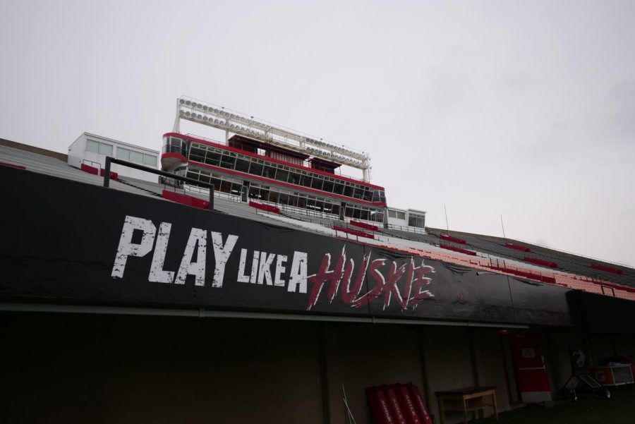 The words Play Like A Huskie on the front side of Huskie Stadiums West bleachers Oct. 19, at Huskie Stadium in DeKalb.