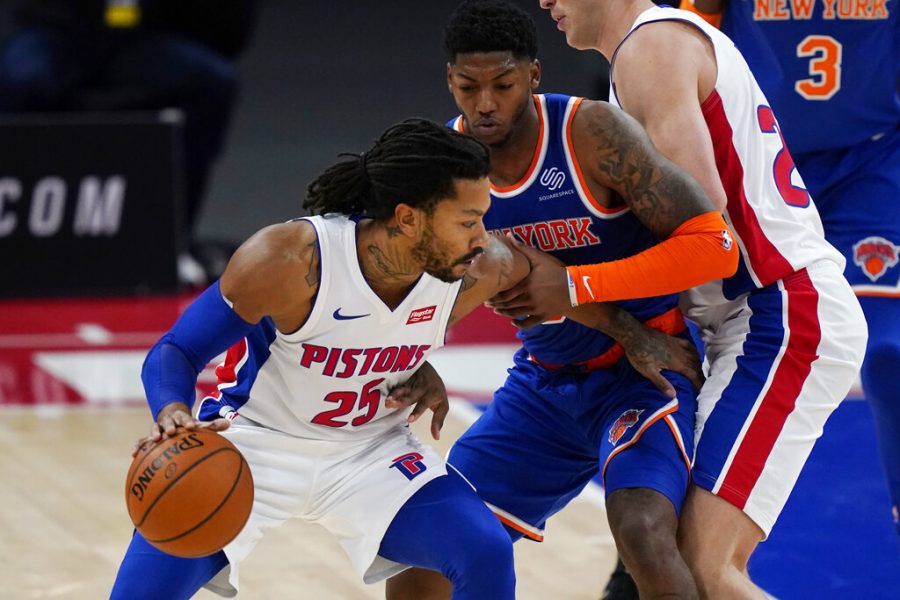Detroit Pistons guard Derrick Rose (25) is defended by New York Knicks guard Elfrid Payton during the first half of a preseason NBA basketball game Friday, Dec. 11, 2020, in Detroit. (AP Photo/Carlos Osorio)