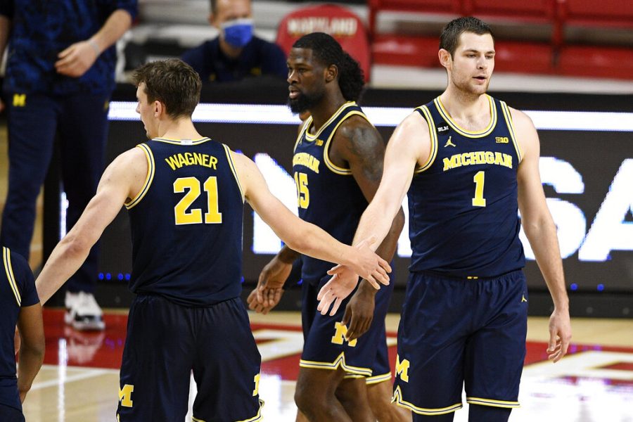 Michigan center Hunter Dickinson (1) and guard Franz Wagner (21) react during the second half of an NCAA college basketball game against Maryland, Thursday, Dec. 31, 2020, in College Park, Md. Michigan won 84-73.