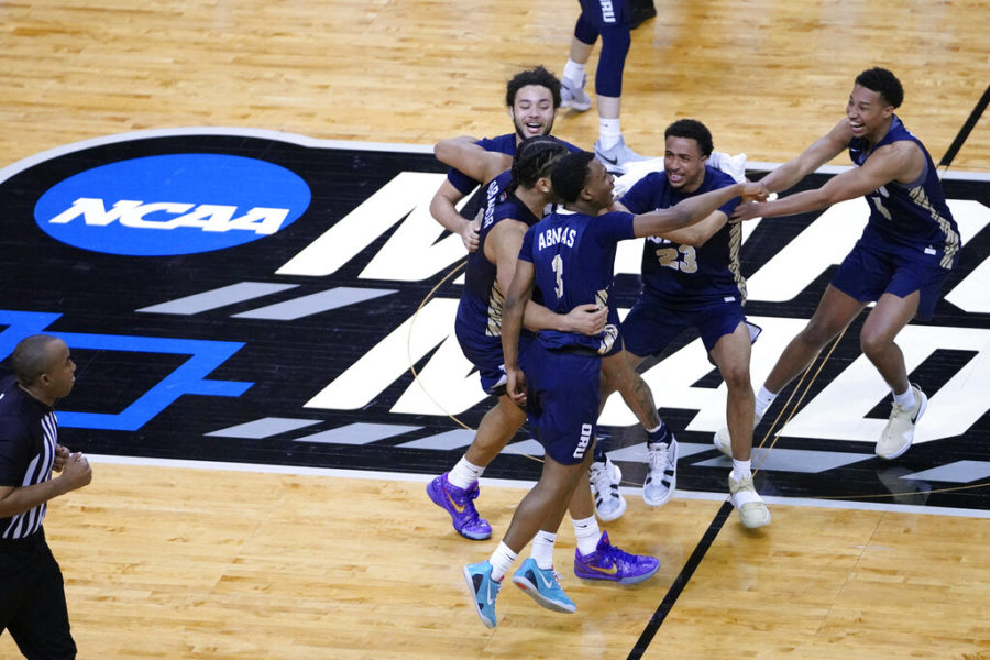 Oral Roberts University players celebrate at the end of a college basketball game against the University of Florida March 21, in the second round of the NCAA tournament at Indiana Farmers Coliseum in Indianapolis.