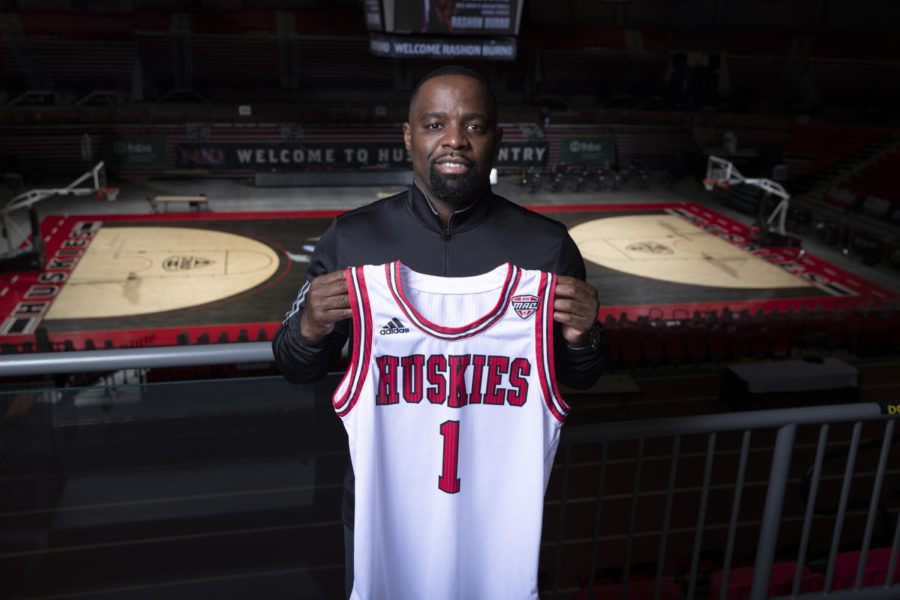 Rashon+Burno+holds+an+NIU+mens+basketball+jersey+March+8%2C+with+the+NIU+Convocation+Centers+court+below+him+in+DeKalb.+NIU+introduced+Burno+as+the+new+mens+basketball+head+coach+Monday.