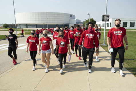 Student-athletes partake in a march outside the Convocation Center on Oct. 10. Following the vandalism of the Center for Black Studies on Sept. 16, student-athletes rallied to the defense of the center and black students across campus.