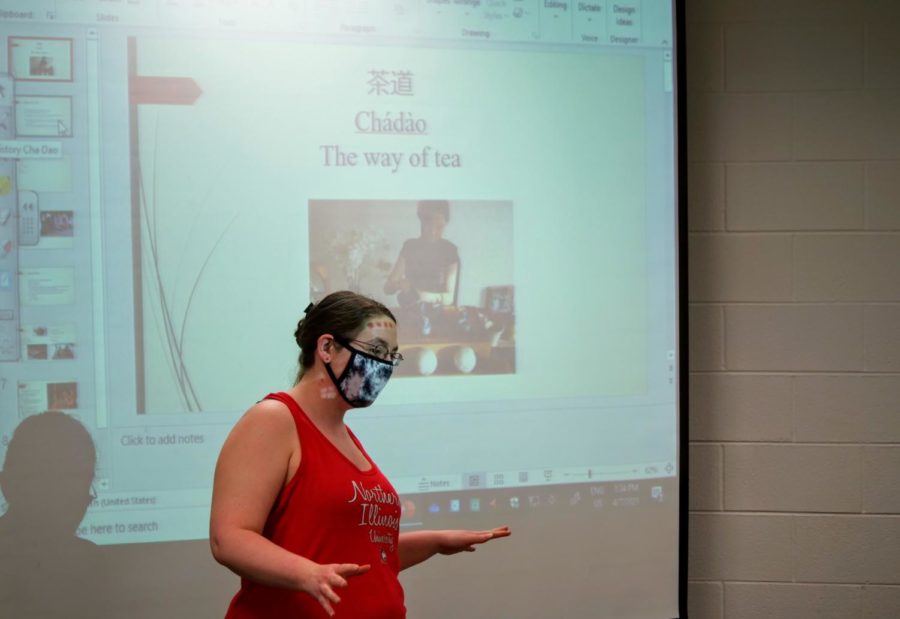 Junior psychology major and Chinese Club treasurer Sam Beightol begins her presentation on the history of tea.