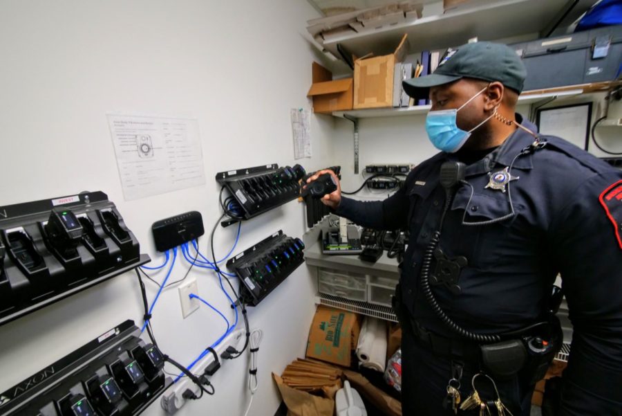 NIU police officer Larry Williams checks his body camera Thursday before putting it on his uniform. All NIU officers are assigned their own body camera.