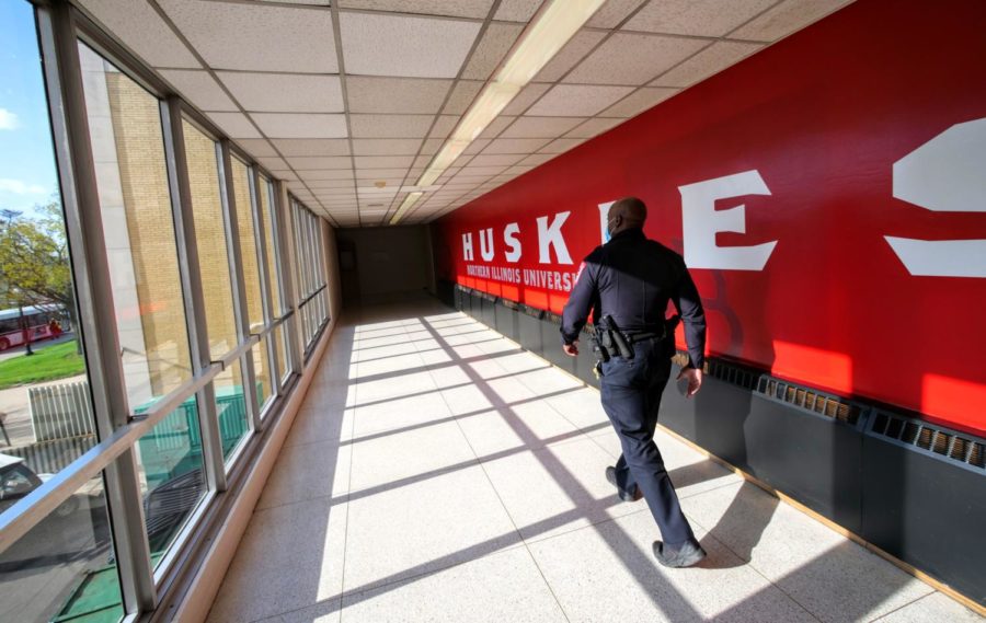 Officer Larry Williams walks down a hallway Thursday in the Holmes Student Center.