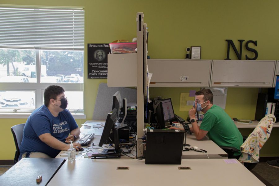 Paginator Jordan Radloff (left) and Editor-in-Chief Wes Sanderson work in the office on the 2021 Back-to-School print edition.