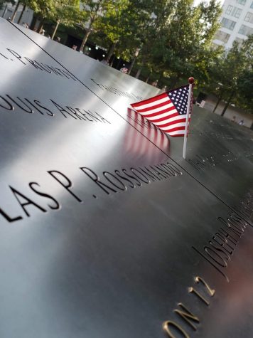 An American flag is placed on the World Trade Center memorial to honor one of the fallen from the Sept. 11 attacks.