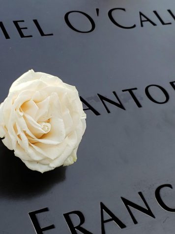 A white rose is placed in the lettering of a person who was killed at the World Trade Center to symbolize their birthday.