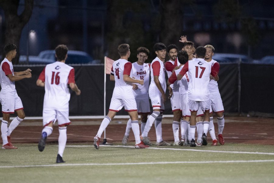 The NIU men's soccer team celebrates a goal in the first half of their 3-0 victory against the Marquette University Golden Eagles on Sept. 10, 2021, in DeKalb. 