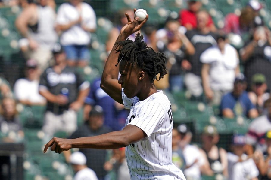 Chicago Bulls Ayo Dosunmo throws out a ceremonial first pitch before a baseball game between the Chicago Cubs and the Chicago White Sox in Chicago, Sunday, Aug. 29, 2021. (AP Photo/Nam Y. Huh)