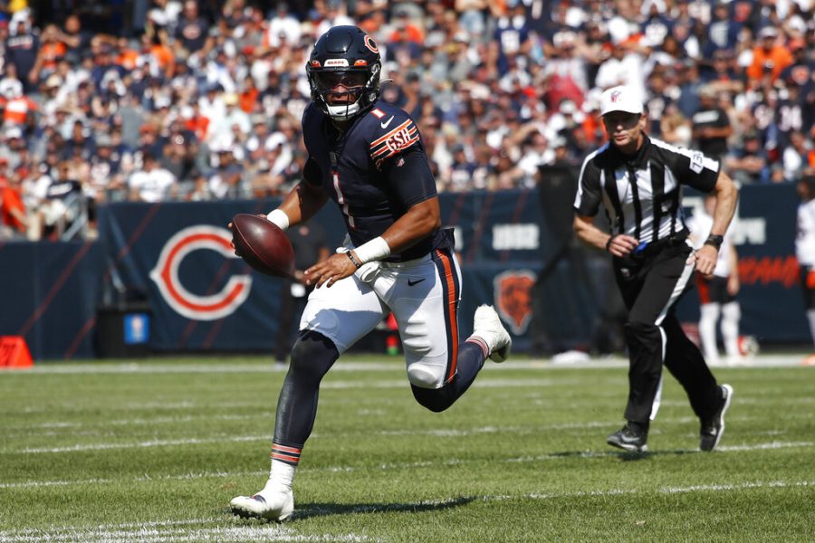 Chicago Bears quarterback Justin Fields (1) runs the ball against the Cincinnati Bengals during an NFL football game Sunday, Sept. 19, 2021, in Chicago. 