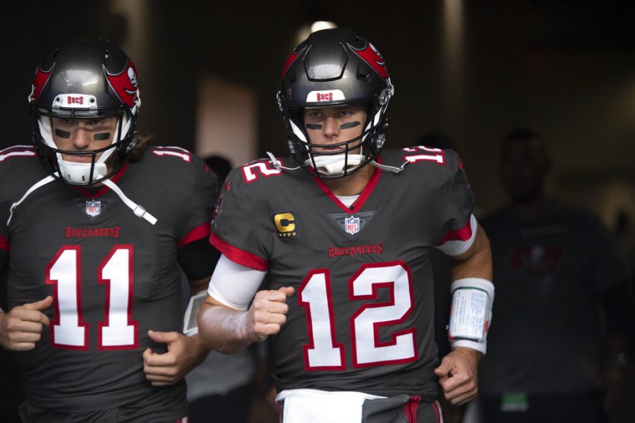 Tampa Bay Buccaneers quarterback Tom Brady (12), right, and quarterback Blaine Gabbert (11) enter the field before an NFL football game against the Los Angeles Rams Sunday, Sept. 26, 2021, in Inglewood, Calif. 