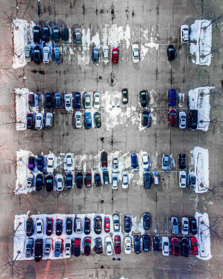 A parking lot with a few spaces left for drivers to park in.