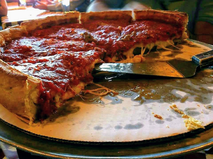 A half-finished Chicago deep dish pizza.