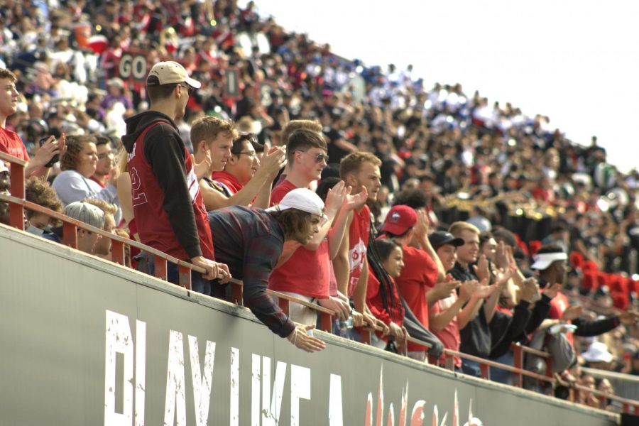 Fans cheer on the NIU football team on Sept. 25, 2021 at Huskie Stadium.