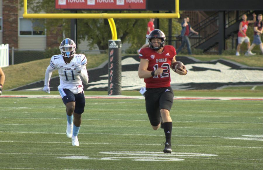 Junior quarterback Rocky Lombardi (right) runs with the ball with Maine sophomore defensive end Khairi Manns in pursuit. Lombardi scored on this play for his second of three rushing touchdowns.