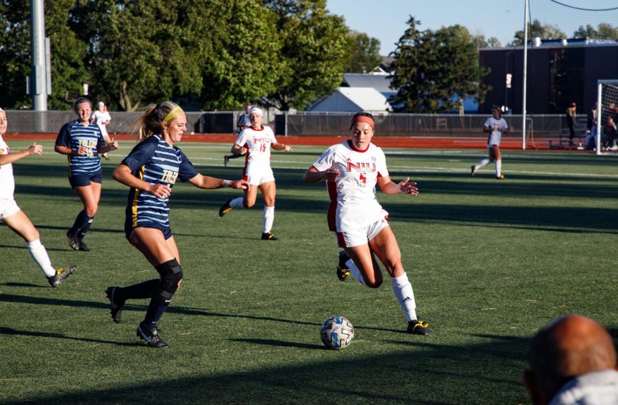 Then-senior defender Jenna Lewey (5) dribbles the ball while playing against the Toledo Rockets on Sept. 23, 2021.