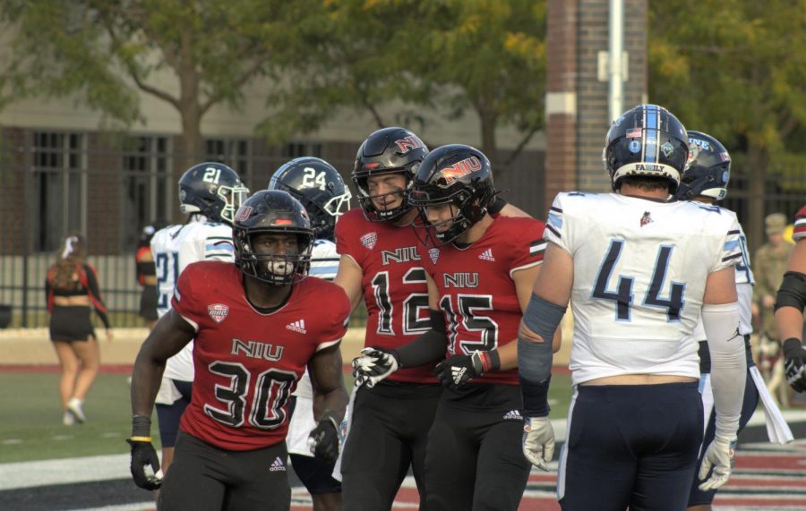 COVID-freshman+running+back+Harrison+Waylee+%28left%29%2C+junior+quarterback+Rocky+Lombardi+%28middle%29+and+redshirt+junior+wide+reciever+Cole+Tucker+celebrate+a+touchdown+run+by+Lombardi+in+NIUs+41-14+win+on+Sept.+25+against+the+University+of+Maine+at+Huskie+Stadium.+The+Huskies+take+a+2-2+record+into+conference+play+that+begins+this+weekend+against+EMU.