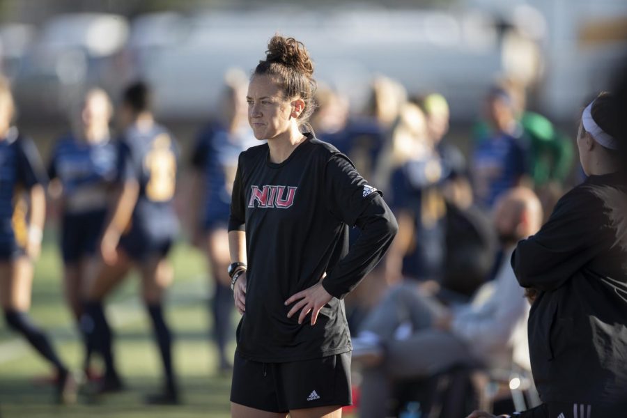 Head womens soccer coach Julie Colhoff watches her team from the sideline.