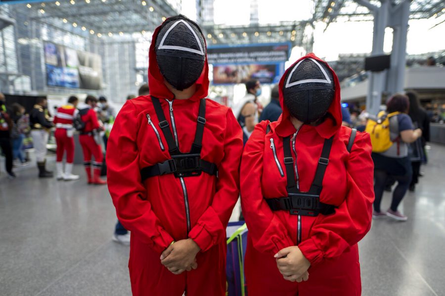 Attendees dressed as characters from Squid Game pose during New York Comic Con at the Jacob K. Javits Convention Center on Friday, Oct. 8, 2021, in New York. 