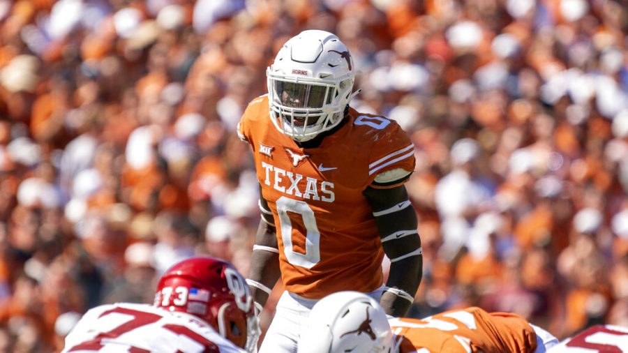 Texas linebacker DeMarvion Overshown (0) waits for the snap during the first half of an NCAA college football game against Oklahoma at the Cotton Bowl, Saturday, Oct. 9, 2021, in Dallas. Oklahoma won 55-48. 